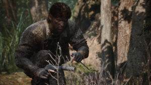 Poste militaire en ruine avec garde patrouillant dans MGS Delta