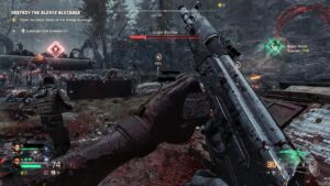 Joueur rechargeant un fusil devant une créature mutante entourée de câbles et d’une structure industrielle.