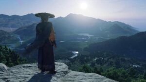 Personnage contemplant un paysage de montagnes dans Ghost of Yōtei