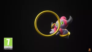 Hoopa surgit à travers un anneau doré sur fond noir